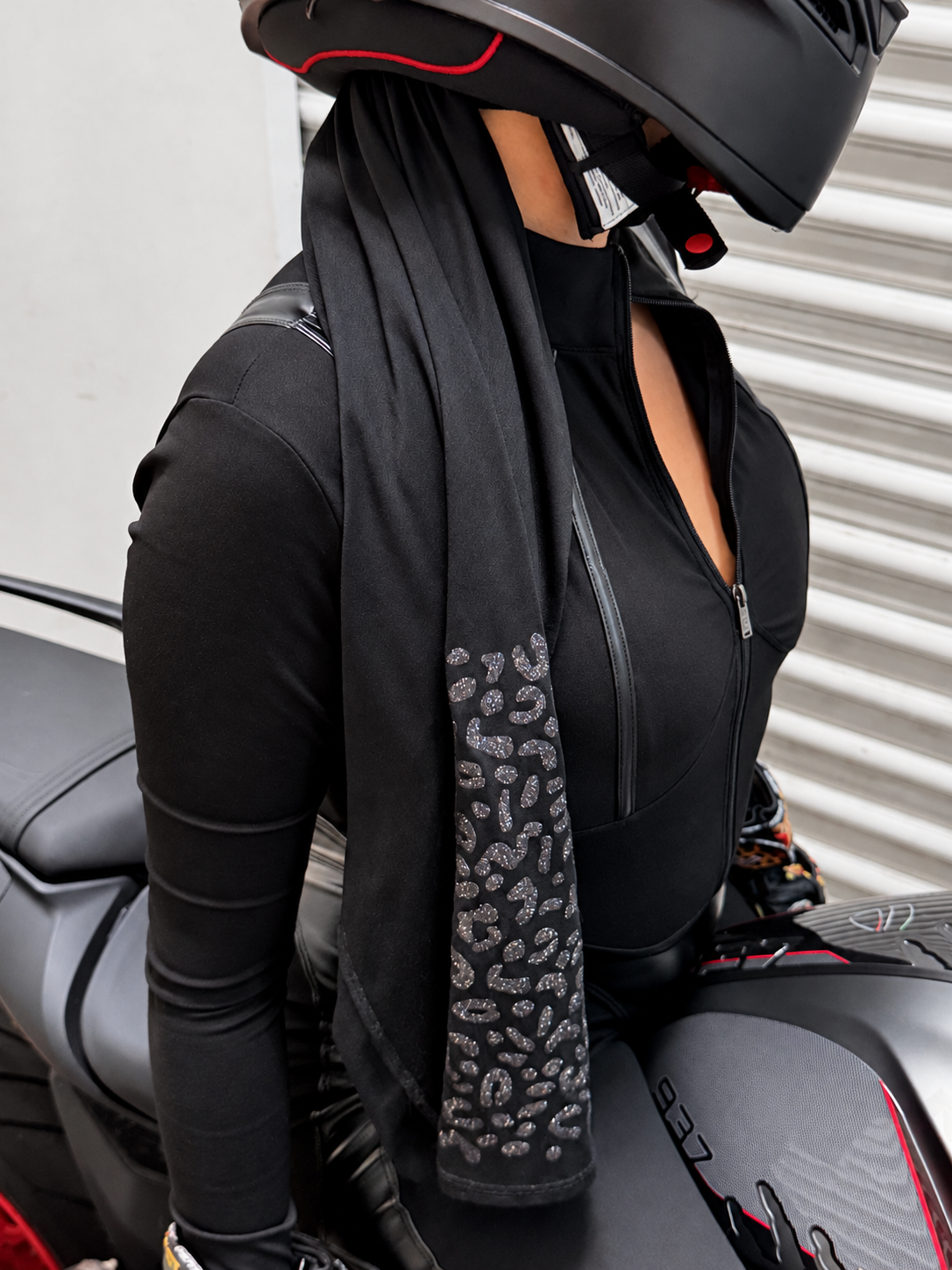 Rider in Brisa Ride balaclava, long hair tucked inside the tail